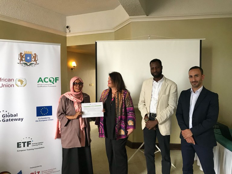 Lady with Cert.jpeg Lady with Cert.jpeg